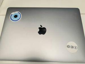 CS1910/2025 MacBook Pro with stickers